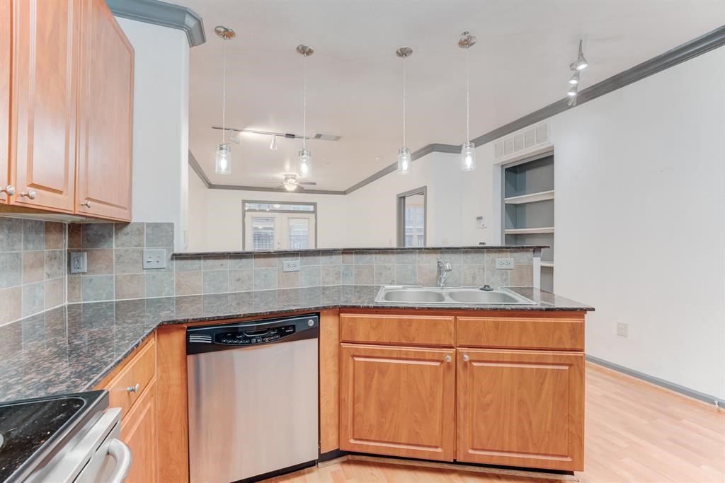 1711 Old Spanish Trail, Unit 110 Houston, TX 77054 - Photo 7 of 31 a kitchen with white cabinets and sink
