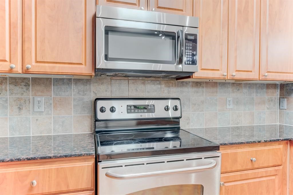 1711 Old Spanish Trail, Unit 110 Houston, TX 77054 - Photo 8 of 31 a stove top oven sitting inside of a kitchen