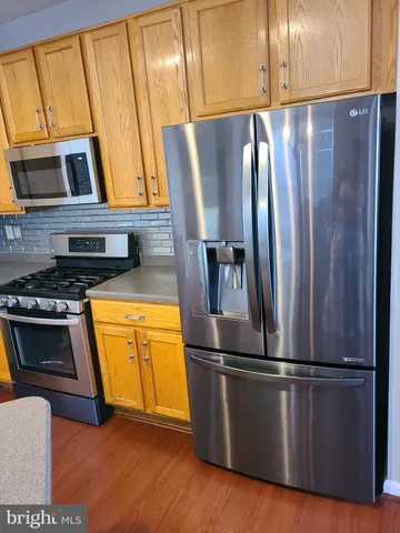 a view of storage and utility room with racks on the wall