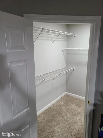 a view of a room with racks on the wall