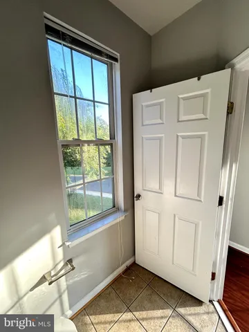 a bathroom with a sink toilet a mirror and tub