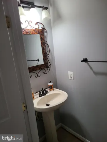 a view of balcony with furniture and wooden floor