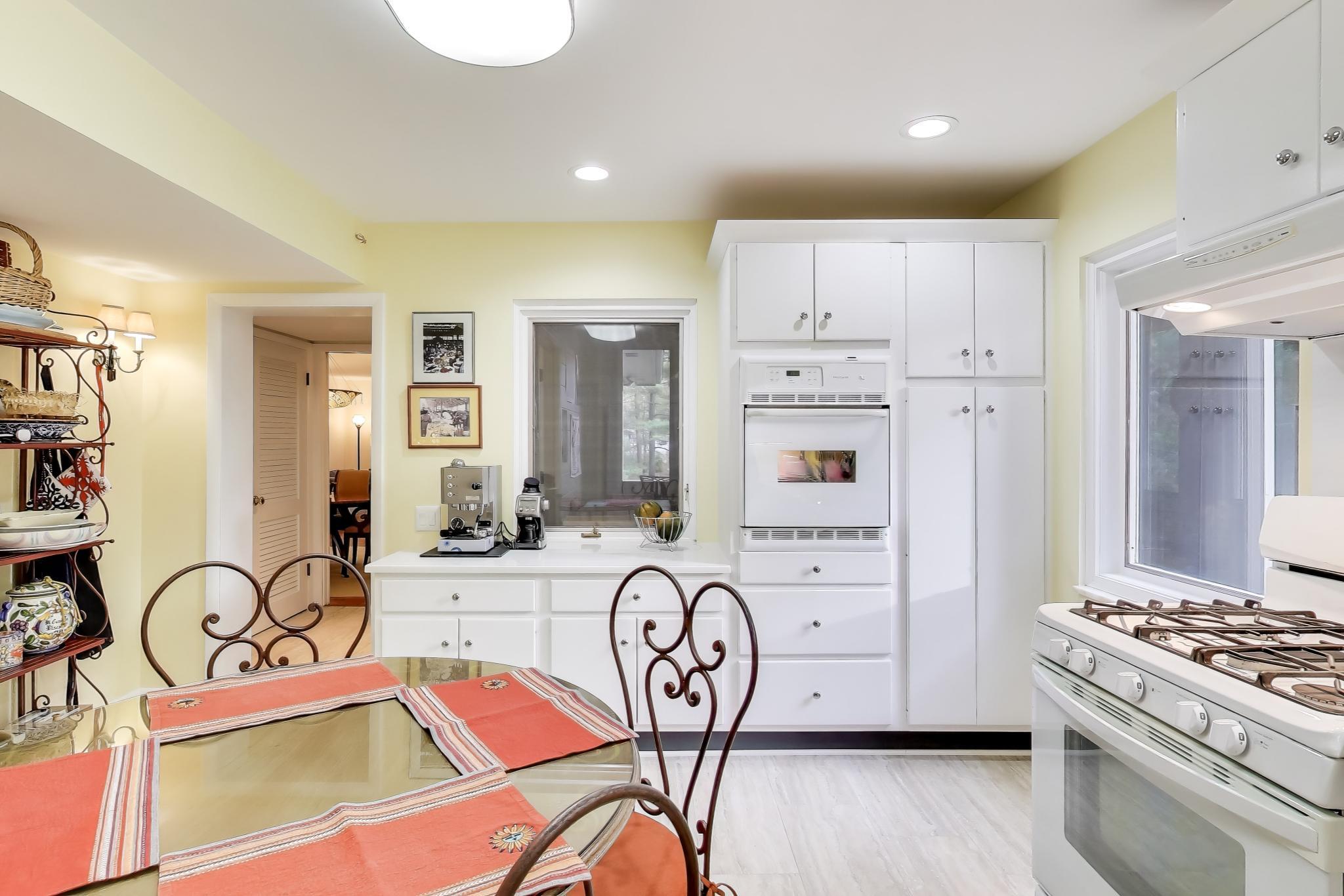 49 Aspen Road Ogden Dunes, IN 46368 - Photo 11 of 42 a kitchen with stainless steel appliances a stove a sink and a refrigerator