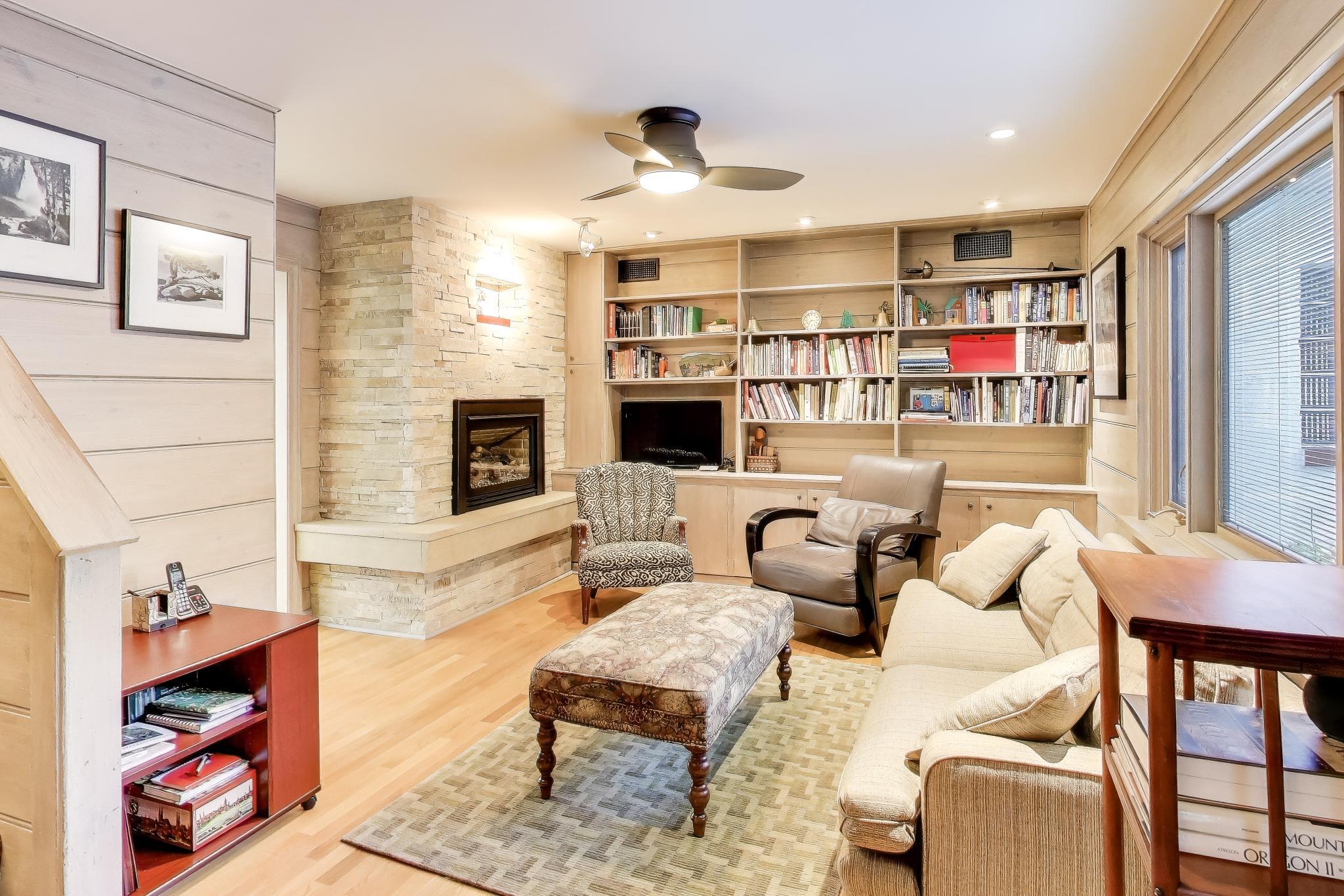 49 Aspen Road Ogden Dunes, IN 46368 - Photo 14 of 42 a living room with fireplace furniture and a flat screen tv