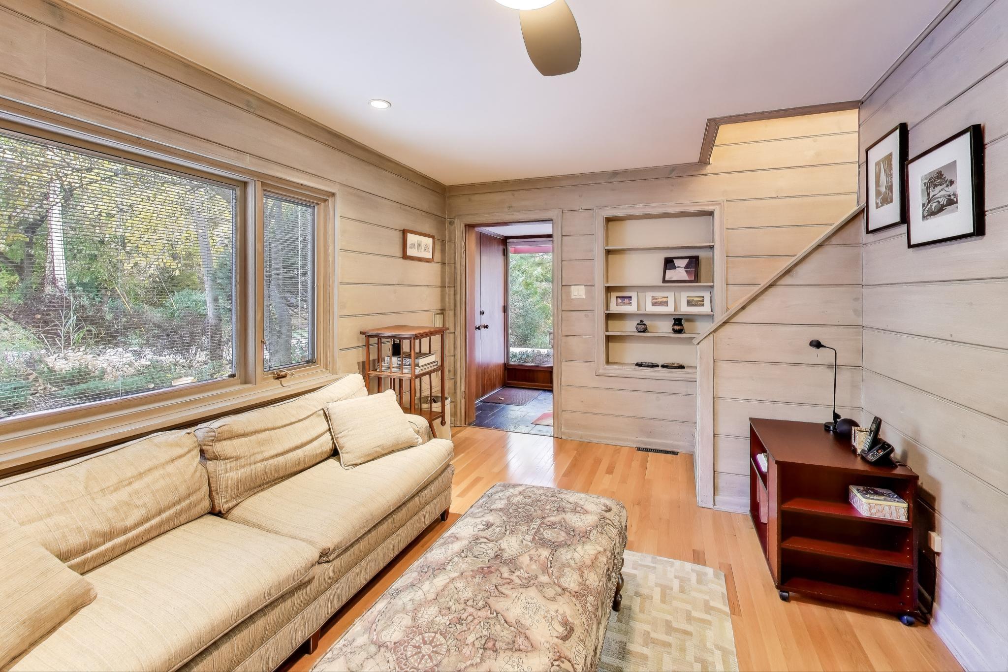 49 Aspen Road Ogden Dunes, IN 46368 - Photo 15 of 42 a living room with furniture and a fireplace