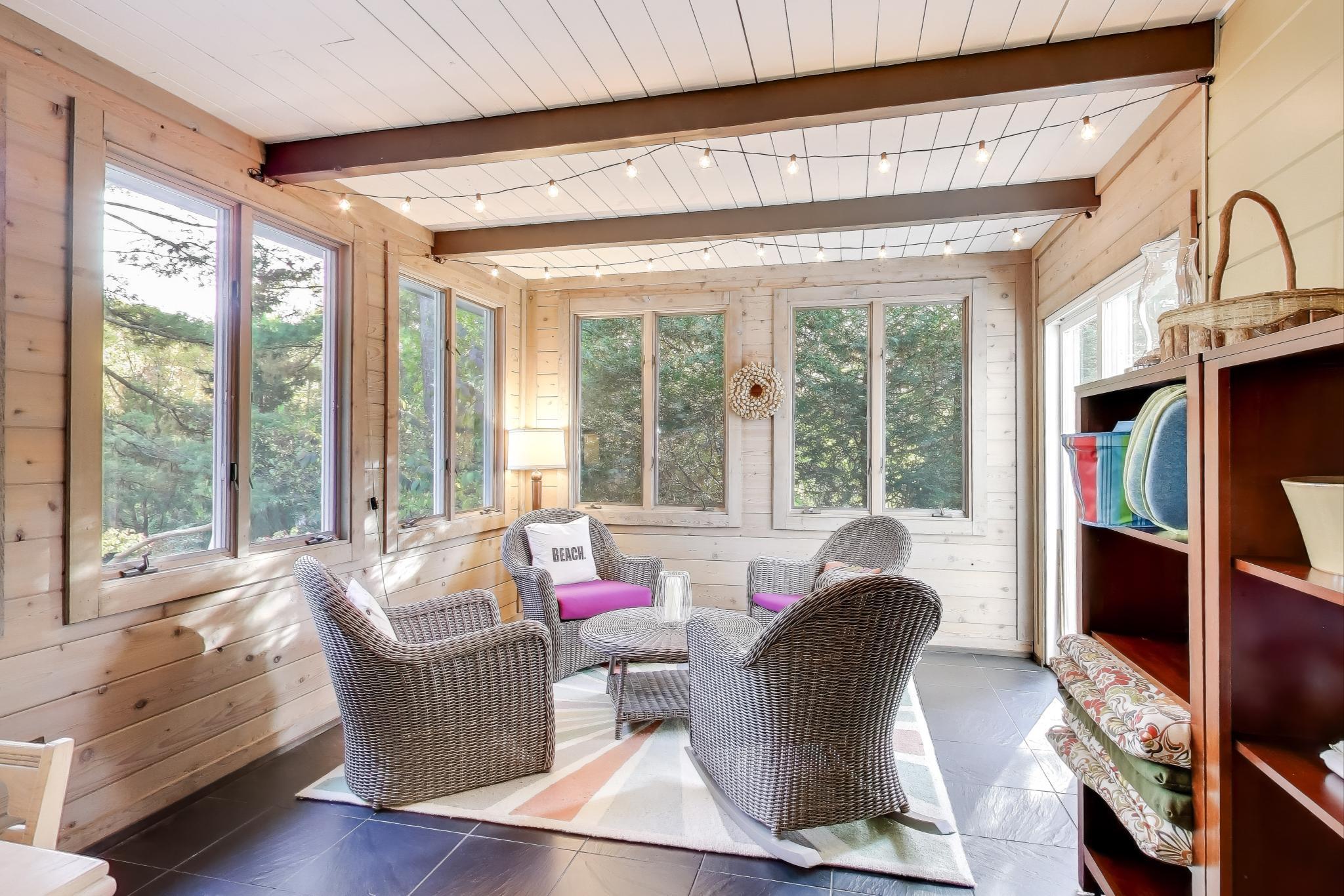 49 Aspen Road Ogden Dunes, IN 46368 - Photo 16 of 42 a living room with furniture and a large window