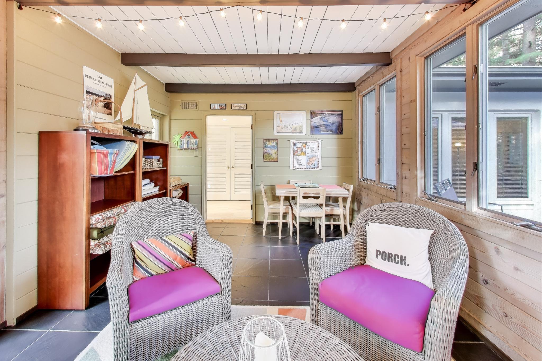 49 Aspen Road Ogden Dunes, IN 46368 - Photo 17 of 42 a living room with furniture a rug and a large window