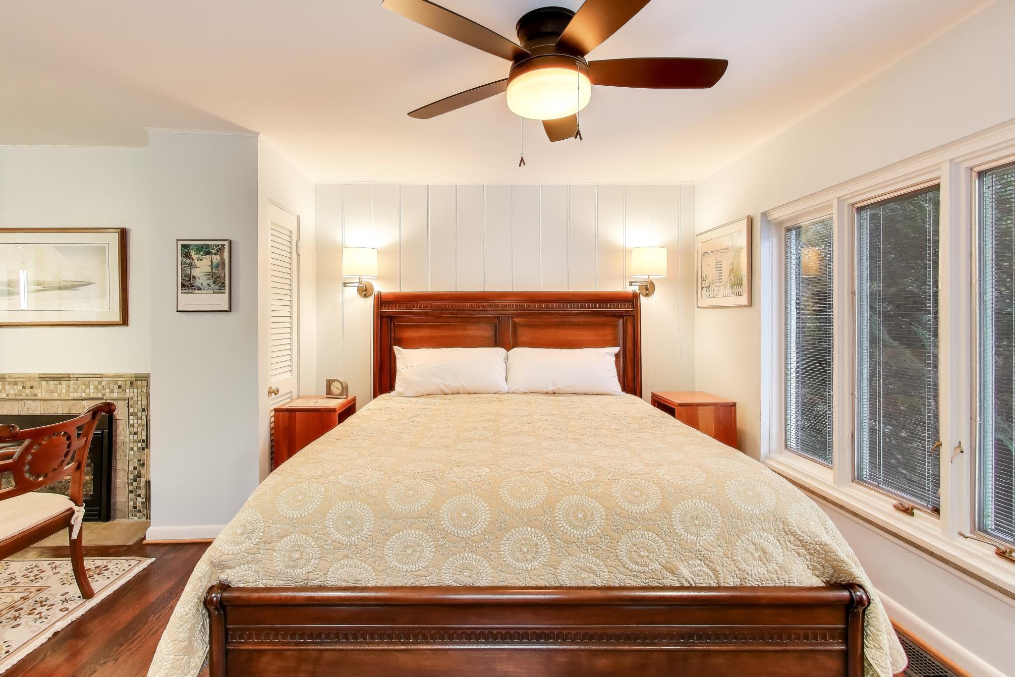 49 Aspen Road Ogden Dunes, IN 46368 - Photo 20 of 42 a bedroom with a bed and a large window with outer view