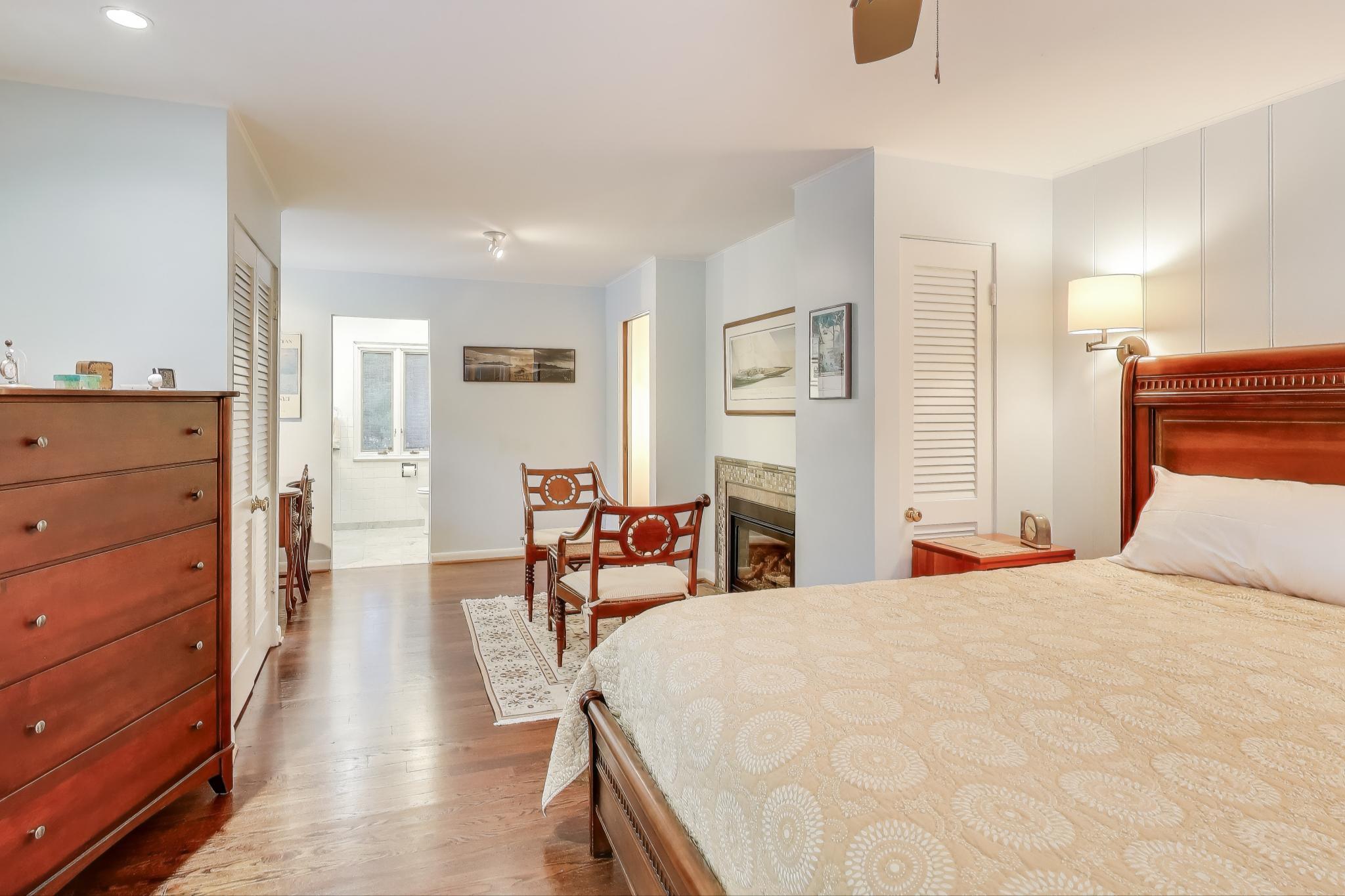 49 Aspen Road Ogden Dunes, IN 46368 - Photo 21 of 42 a bedroom with a bed and wooden floor