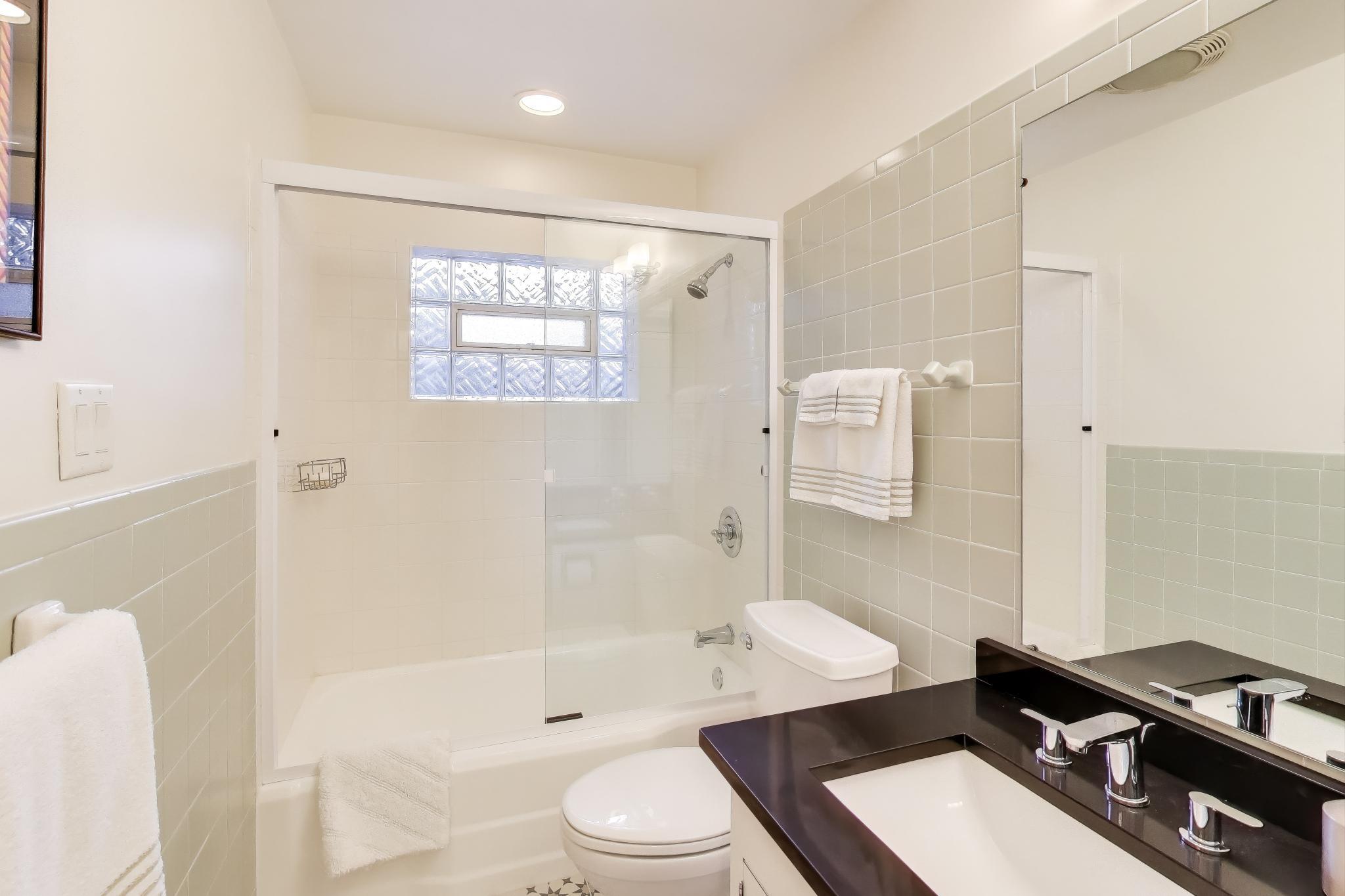 49 Aspen Road Ogden Dunes, IN 46368 - Photo 25 of 42 a bathroom with a sink a toilet and shower