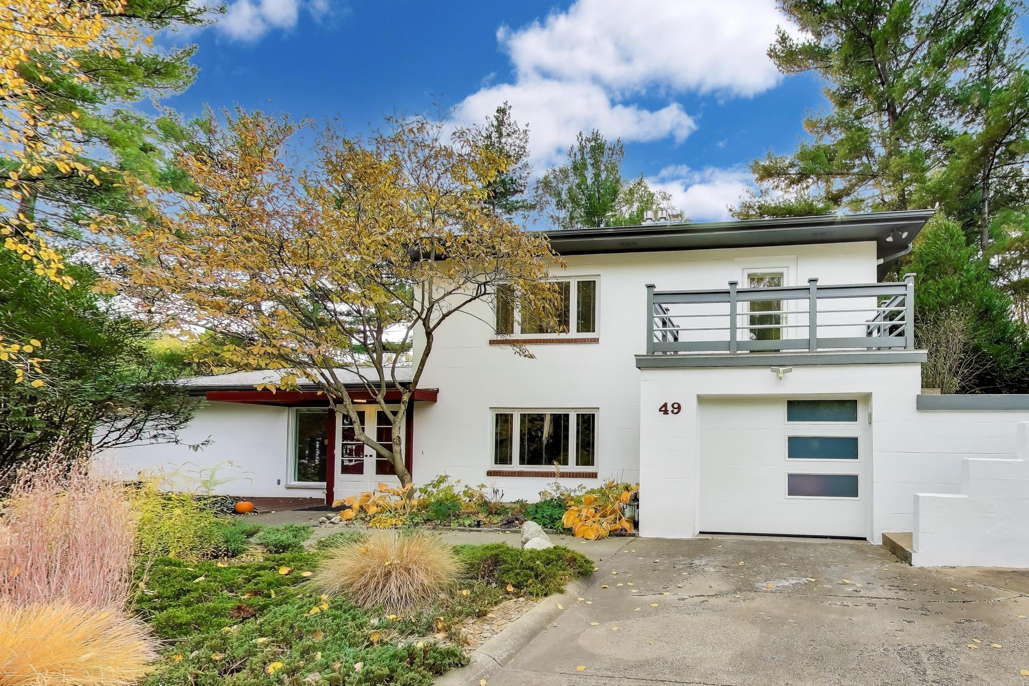 49 Aspen Road Ogden Dunes, IN 46368 - Photo 3 of 42 front view of a house with a tree
