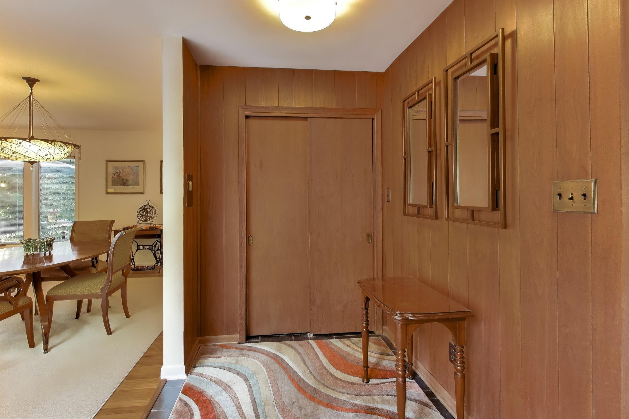 49 Aspen Road Ogden Dunes, IN 46368 - Photo 6 of 42 a bedroom with a bed and a chandelier