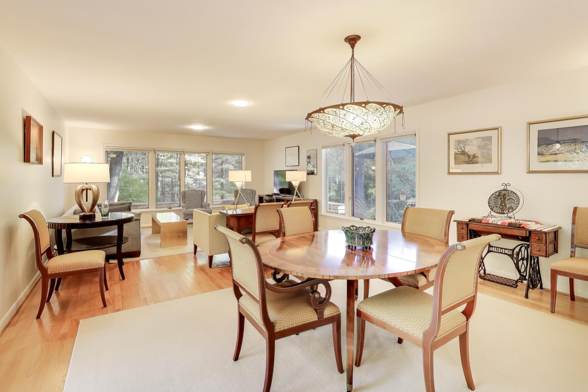 49 Aspen Road Ogden Dunes, IN 46368 - Photo 8 of 42 a dining room with furniture a chandelier and wooden floor