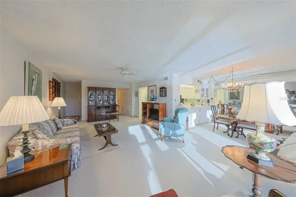 a living room with furniture and a lamp