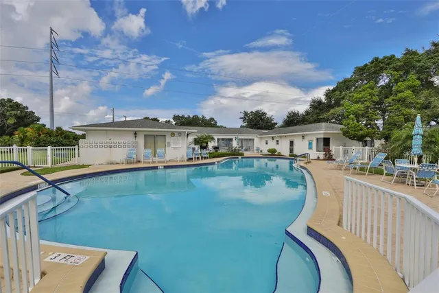 a balcony with table and chairs