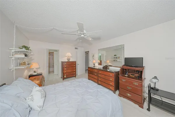 a bed room with a bed and a television