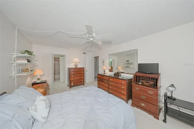 a bed room with a bed and a television