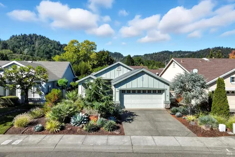 a front view of a house with a garden