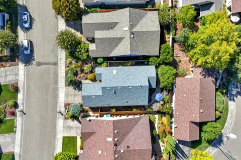 an aerial view of multiple houses with outdoor space