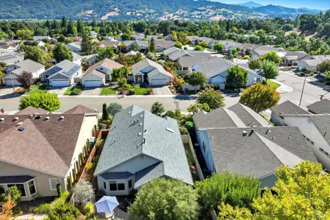 a view of a room with wooden floor and fireplace