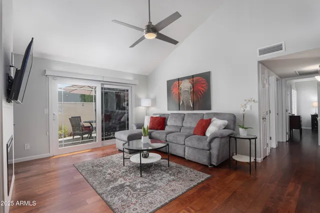 a living room with furniture and a rug