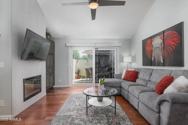 a living room with furniture and a fireplace