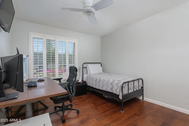 a bedroom with a workspace