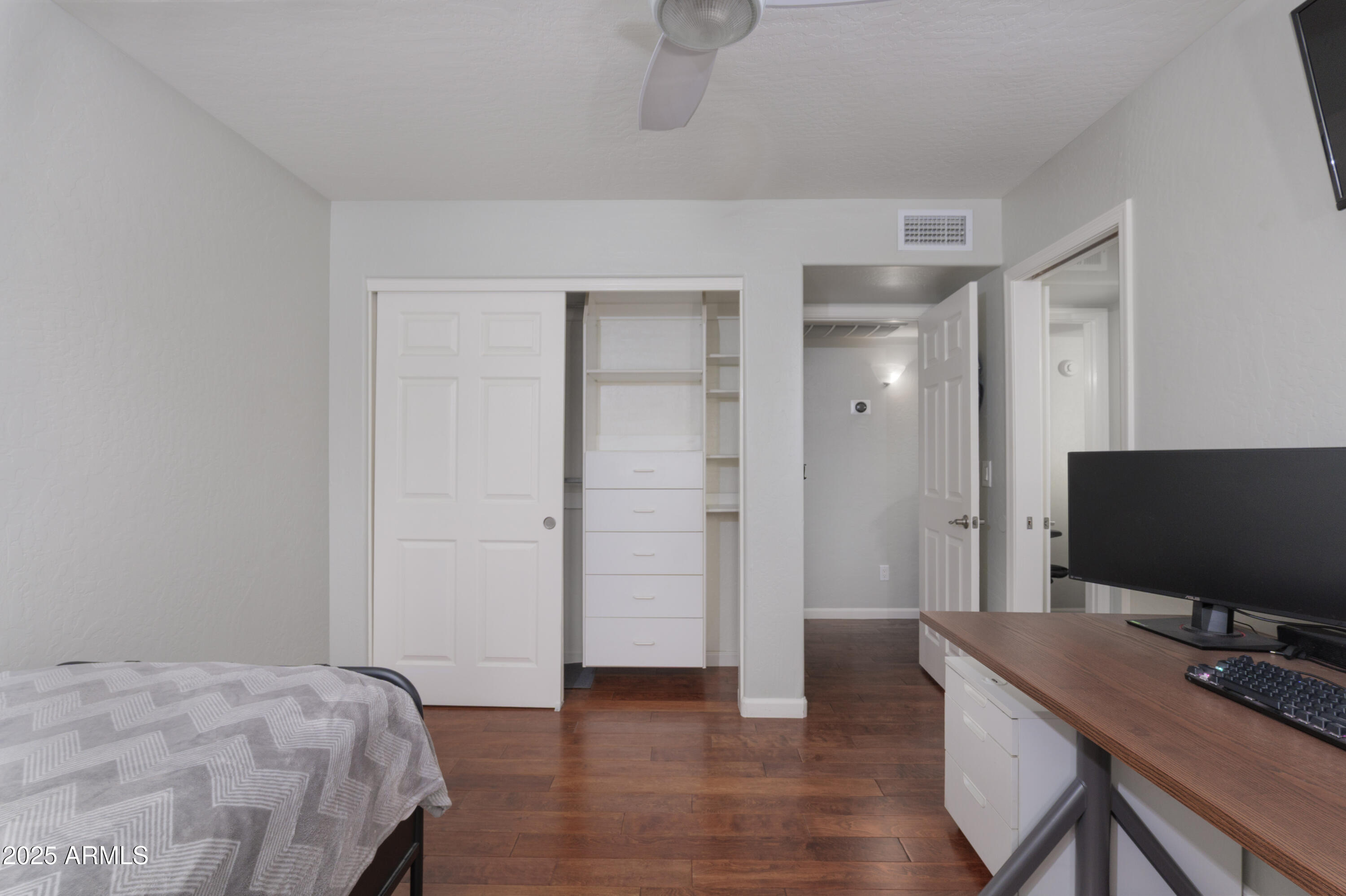 2100 West Lemon Tree Place, Unit 78 Chandler, AZ 85224 - Photo 17 of 32 a bedroom with a bed and a flat screen tv