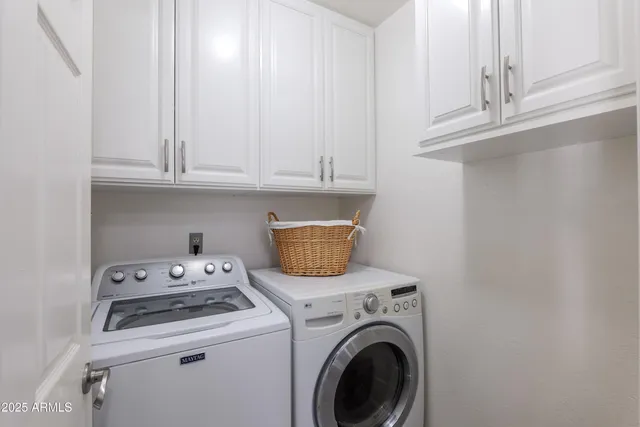 a view of washer and dryer with kitchen appliances
