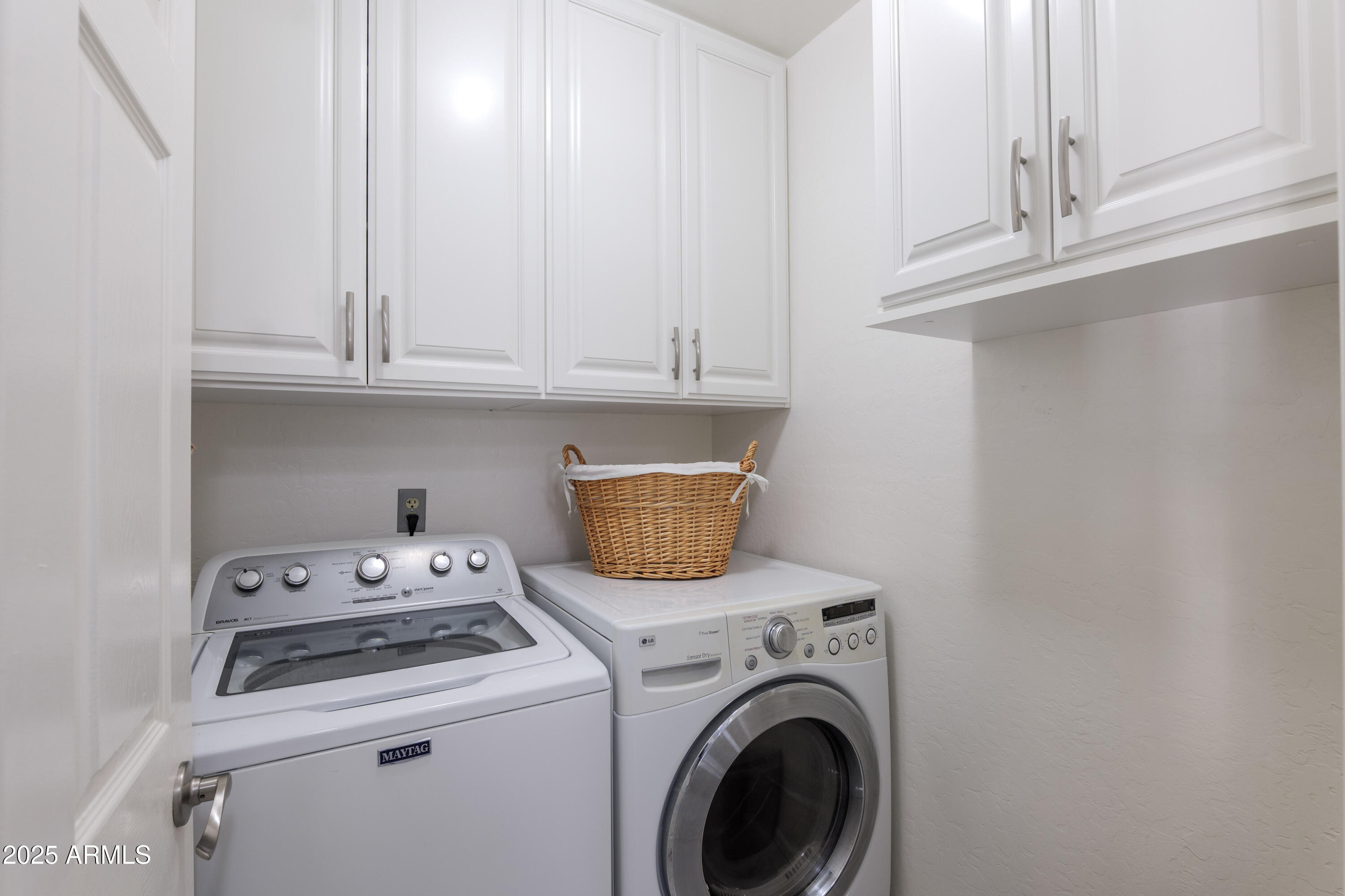 2100 West Lemon Tree Place, Unit 78 Chandler, AZ 85224 - Photo 19 of 32 a view of washer and dryer with kitchen appliances
