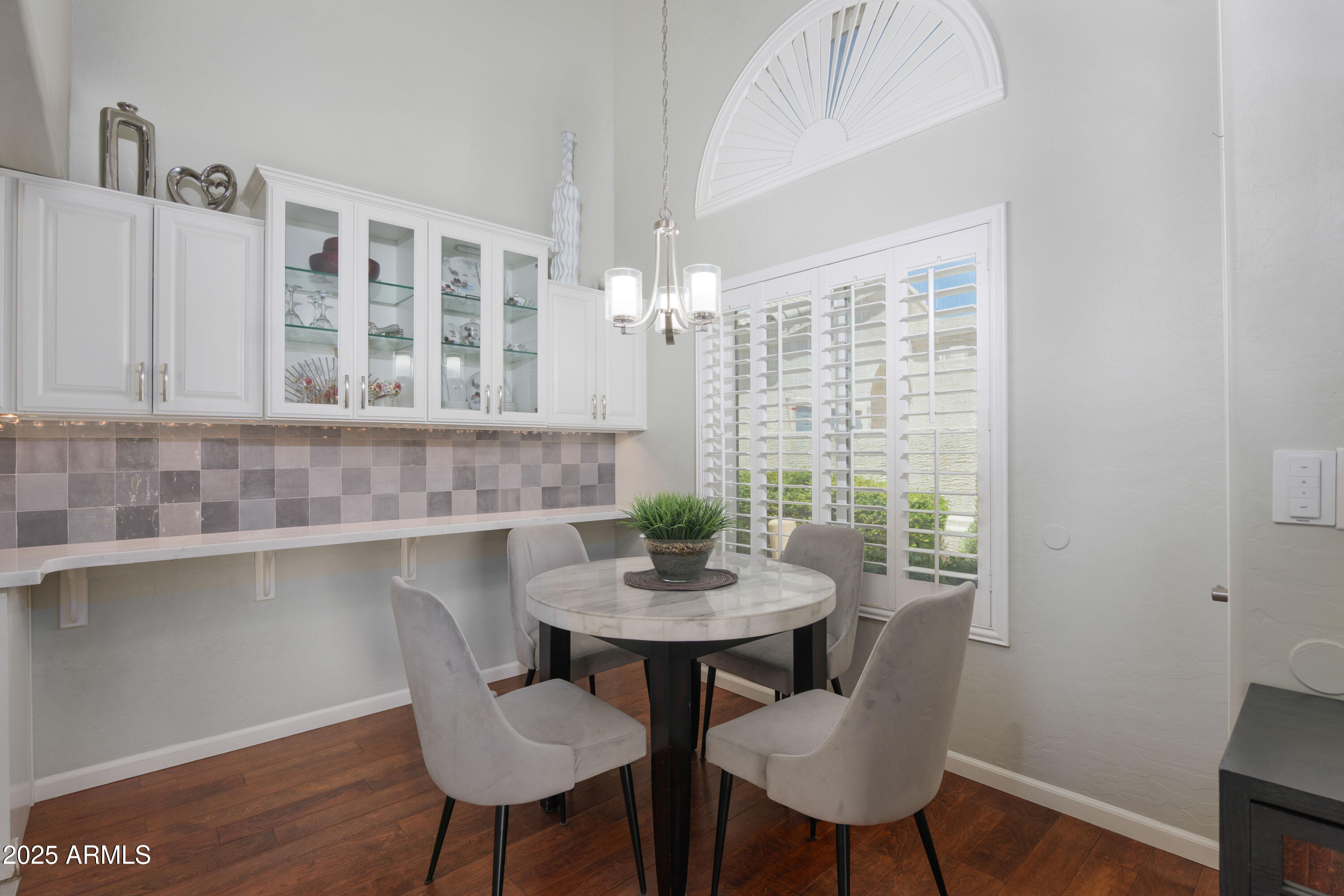 2100 West Lemon Tree Place, Unit 78 Chandler, AZ 85224 - Photo 2 of 32 a view of a dining room with furniture and wooden floor