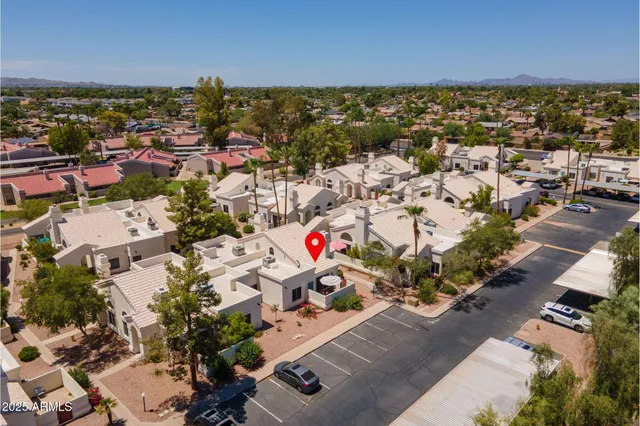 an aerial view of residential houses with outdoor space