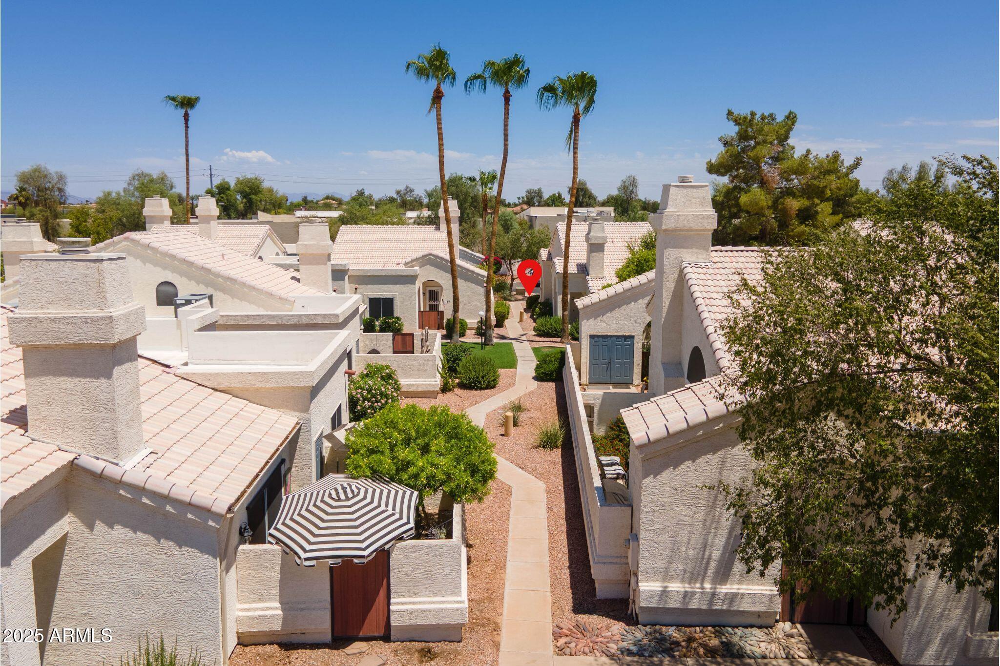 2100 West Lemon Tree Place, Unit 78 Chandler, AZ 85224 - Photo 26 of 32 a view of an chairs and tables in patio