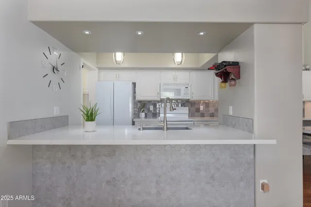 a view of a living room and chandelier
