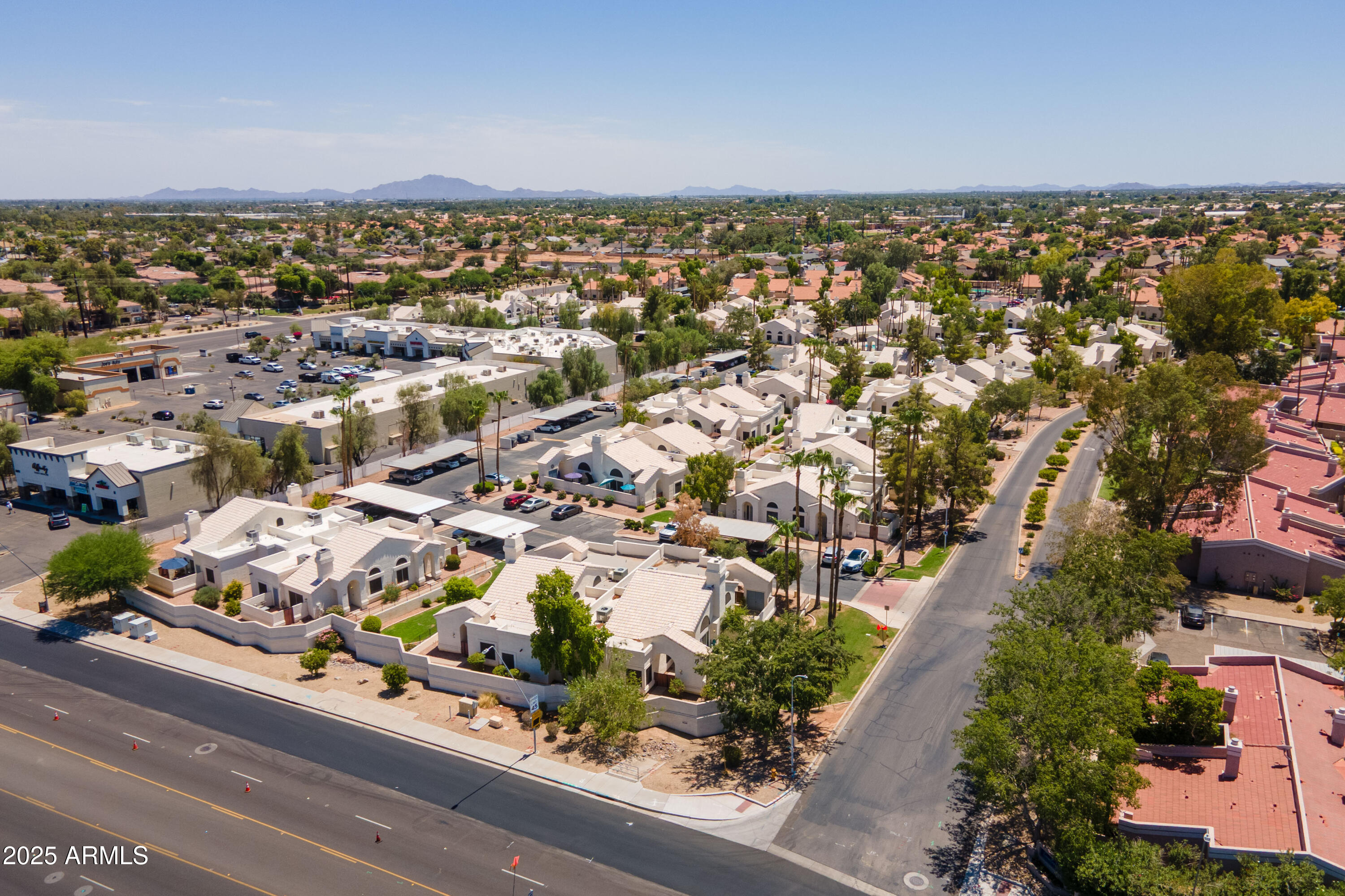 2100 West Lemon Tree Place, Unit 78 Chandler, AZ 85224 - Photo 32 of 32 an aerial view of residential houses with outdoor space