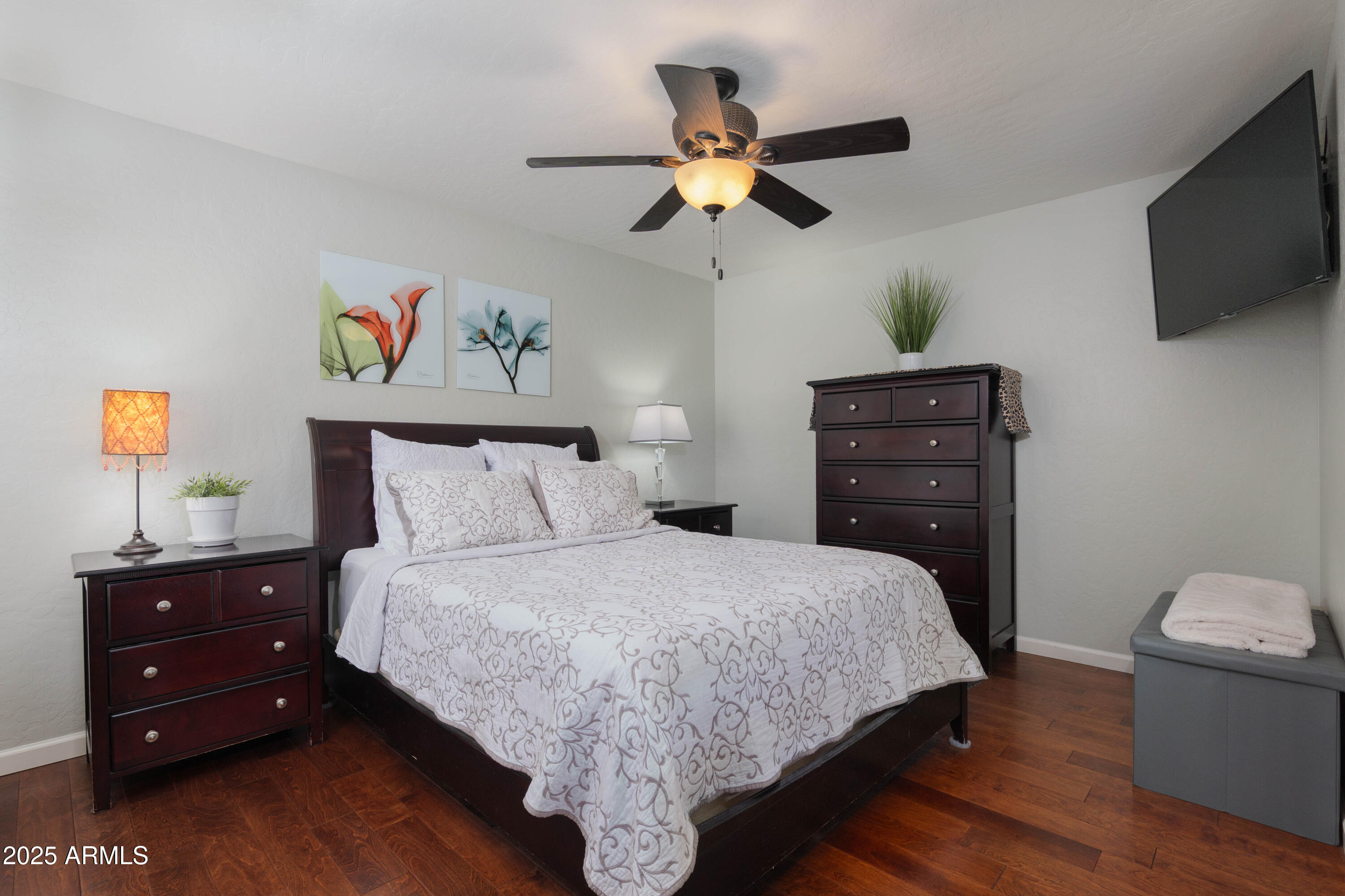 2100 West Lemon Tree Place, Unit 78 Chandler, AZ 85224 - Photo 6 of 32 a bedroom with a bed and a flat screen tv
