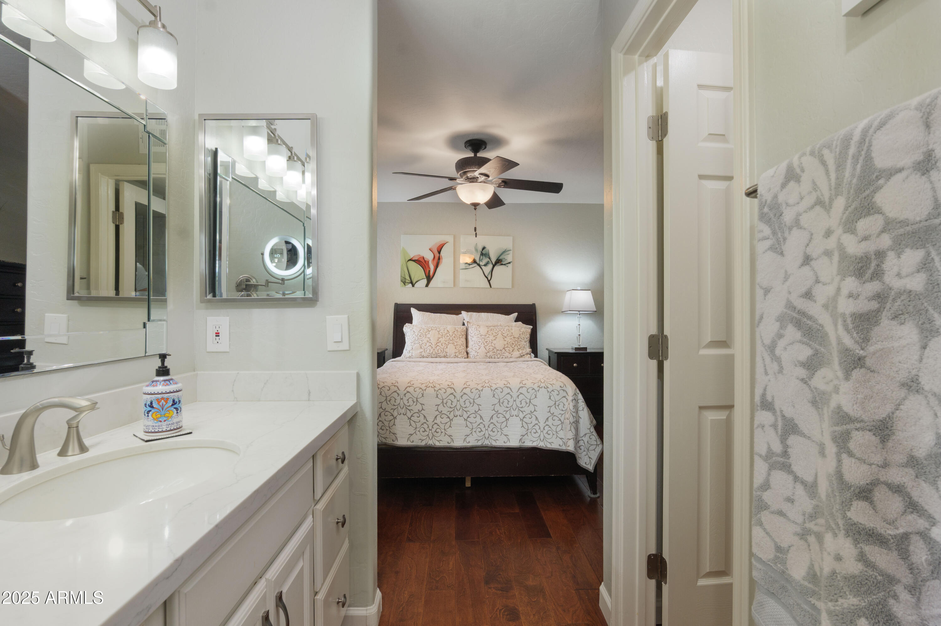 2100 West Lemon Tree Place, Unit 78 Chandler, AZ 85224 - Photo 9 of 32 a bathroom with a sink and a mirror