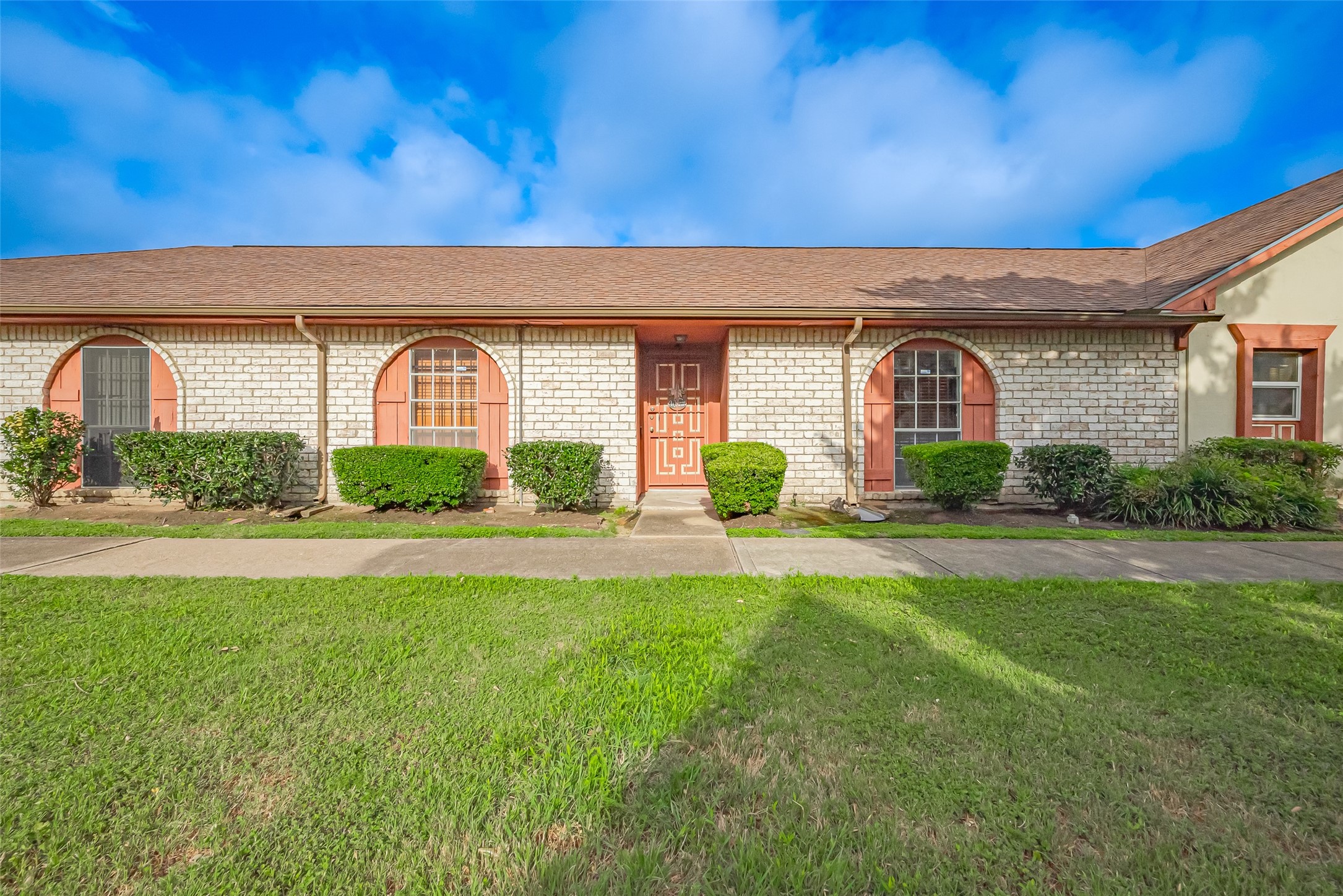 a front view of a house with garden
