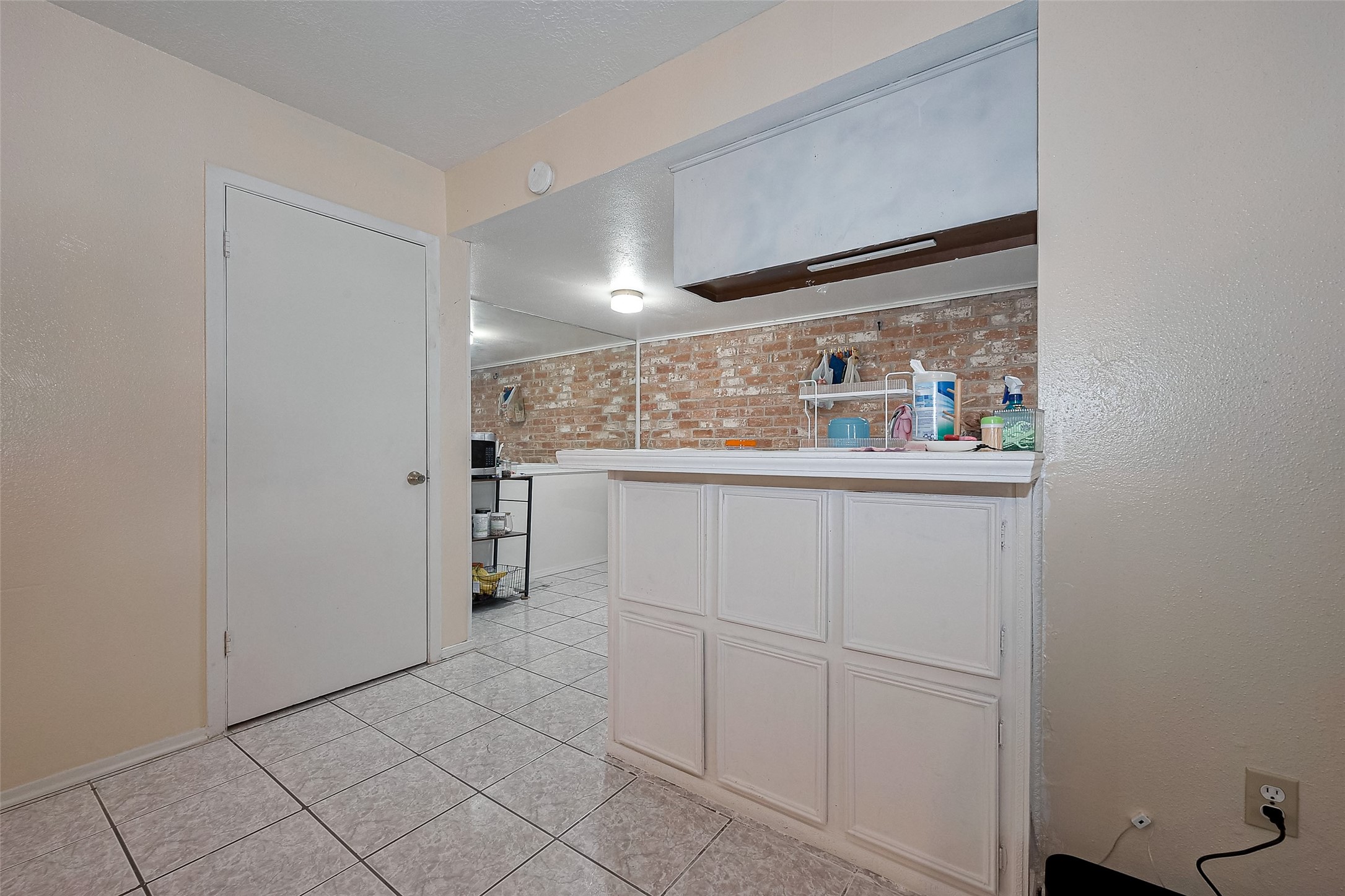 12223 Sharpview Drive Houston, TX 77072 - Photo 17 of 41 a kitchen with white cabinets and white appliances