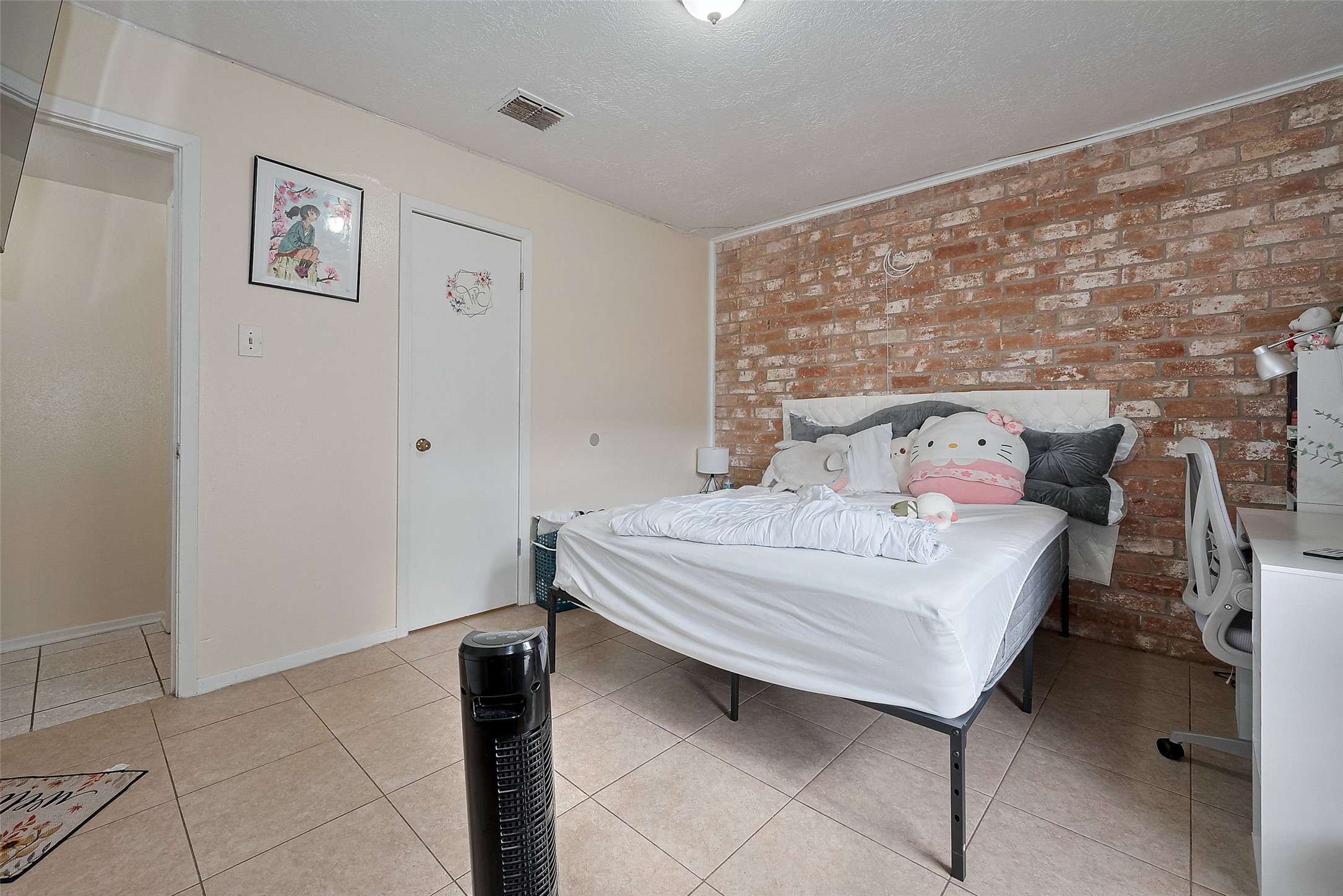 12223 Sharpview Drive Houston, TX 77072 - Photo 29 of 41 a bedroom with a bed and wooden floor