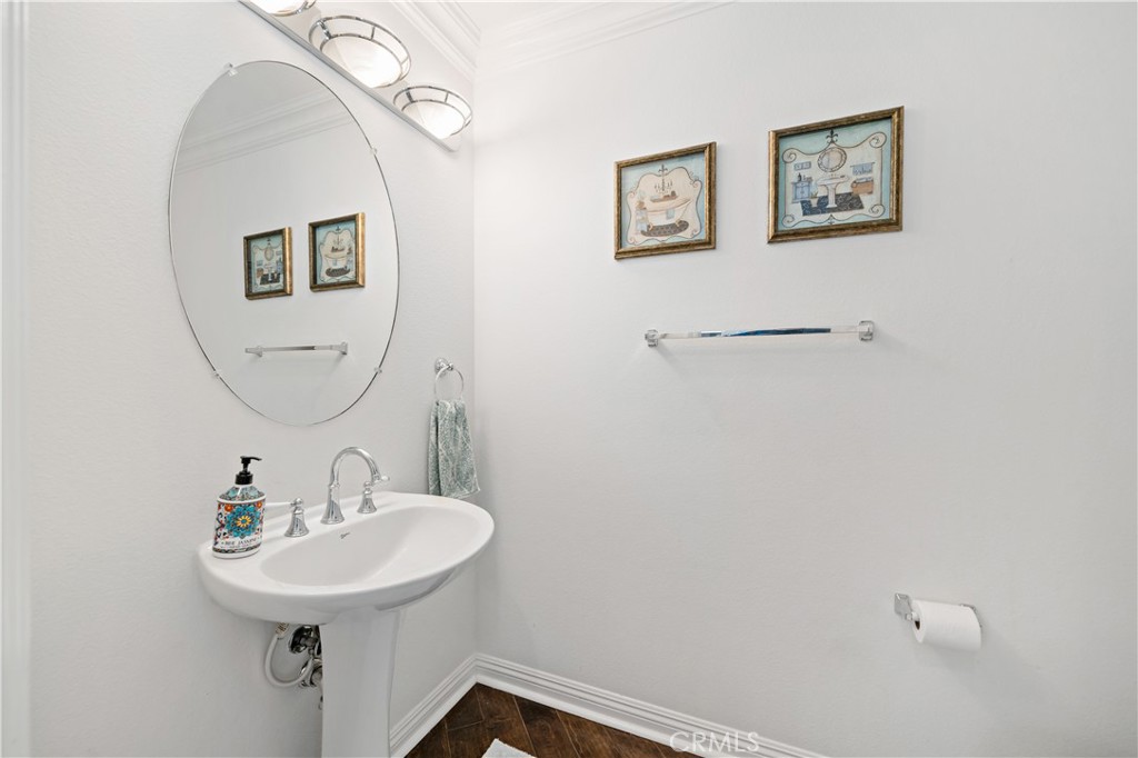 16423 Village Meadow Drive Riverside, CA 92503 - Photo 18 of 61 a bathroom with a sink mirror and vanity