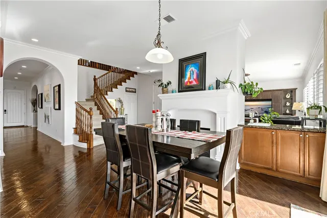 a living room with furniture a rug and a flat screen tv