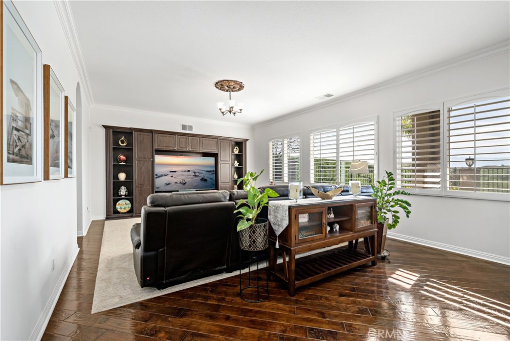 16423 Village Meadow Drive Riverside, CA 92503 - Photo 24 of 61 a living room with furniture and a flat screen tv