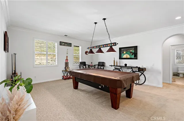 a bedroom with a bed and flat screen tv