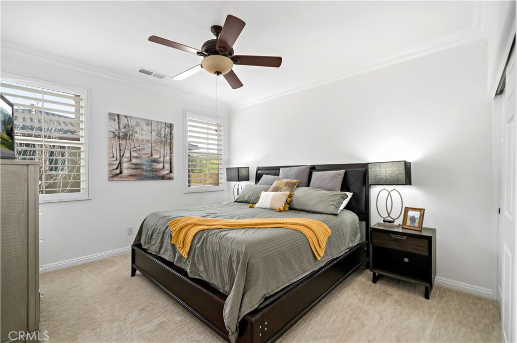 16423 Village Meadow Drive Riverside, CA 92503 - Photo 33 of 61 a bedroom with a bed and window