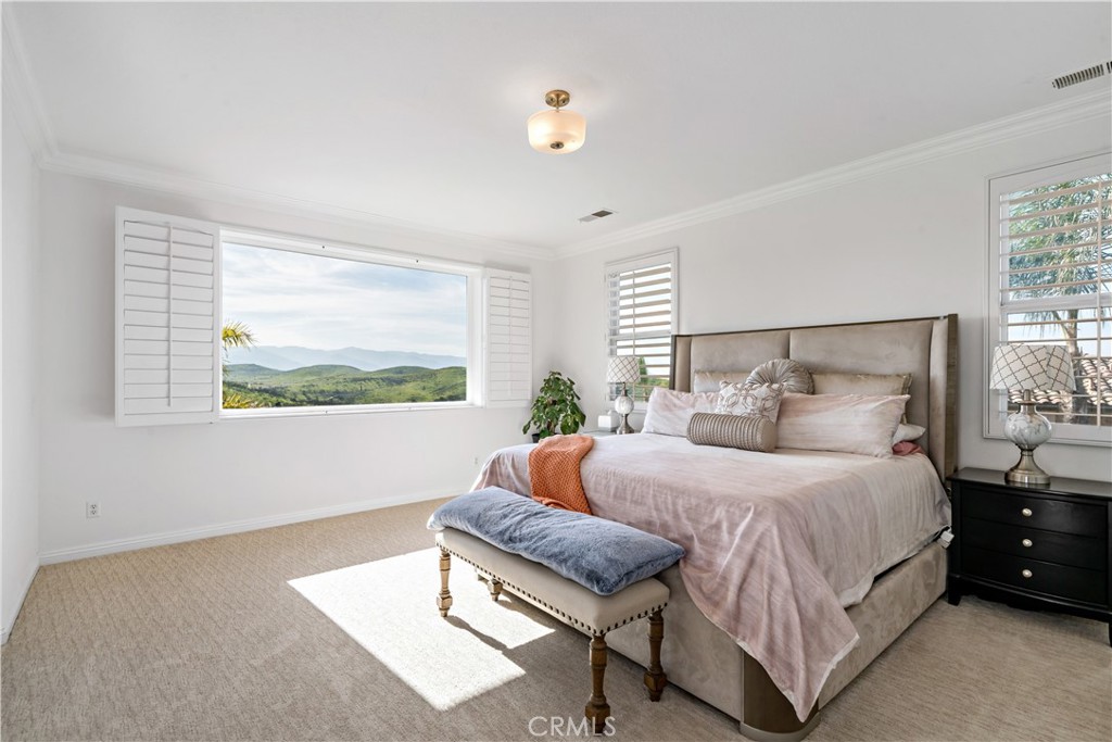 16423 Village Meadow Drive Riverside, CA 92503 - Photo 41 of 61 a bedroom with a bed and window