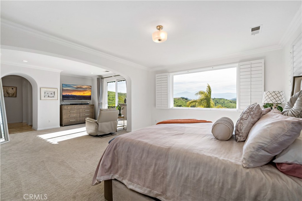 16423 Village Meadow Drive Riverside, CA 92503 - Photo 42 of 61 a bedroom with a bed and window