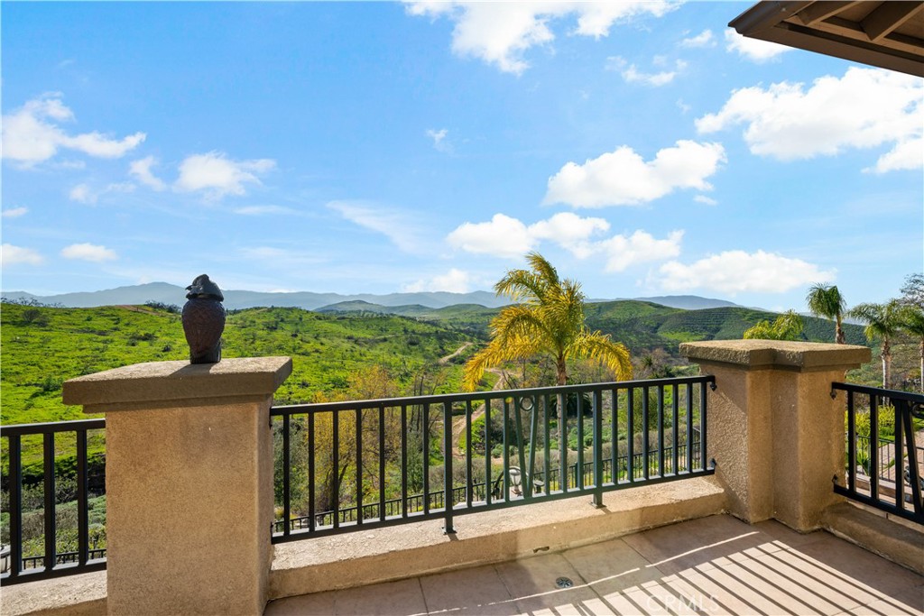 16423 Village Meadow Drive Riverside, CA 92503 - Photo 47 of 61 a view of a balcony with an ocean view