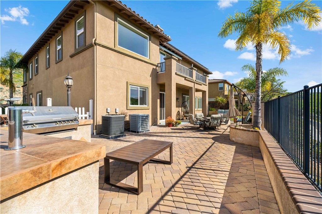 16423 Village Meadow Drive Riverside, CA 92503 - Photo 56 of 61 a view of a patio with swimming pool table and chairs