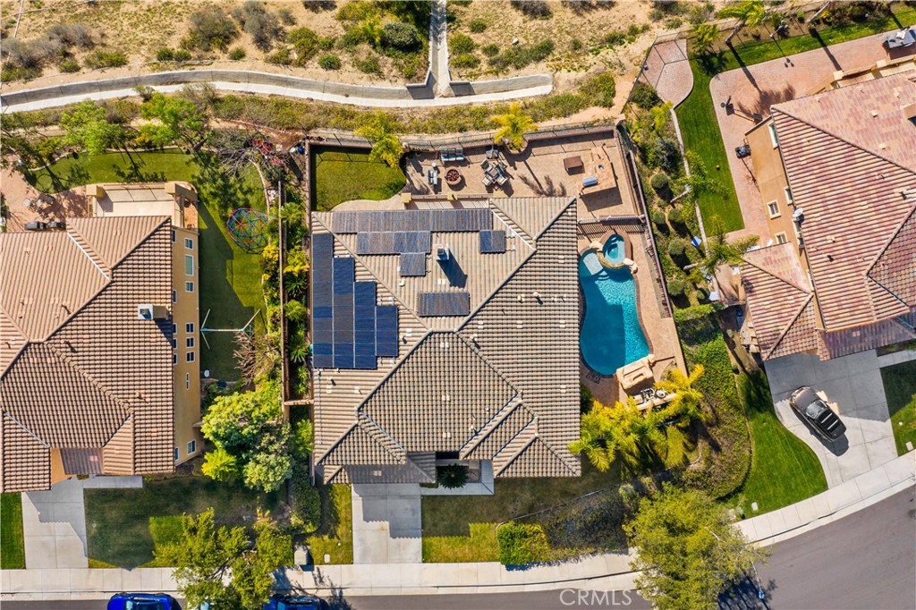 16423 Village Meadow Drive Riverside, CA 92503 - Photo 6 of 61 aerial view of a house with a yard and potted plants